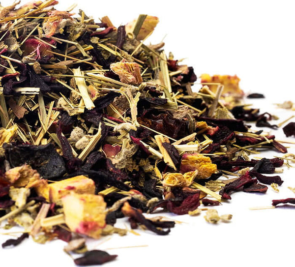close up of hibiscus cucumber loose leaf tea blend on a white background