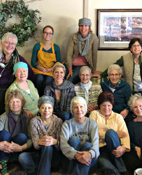 a group of people smile at the camera