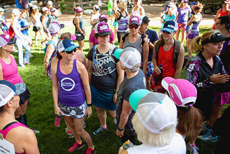 a group of people smile before a charity race