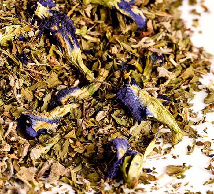 a pile of loose leaf tea with butterfly pea flowers visible
