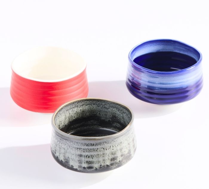 three matcha bowls, grey, red, and blue