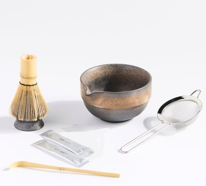 a matcha set with matcha bowl matcha whisk, matcha sift, matcha packets