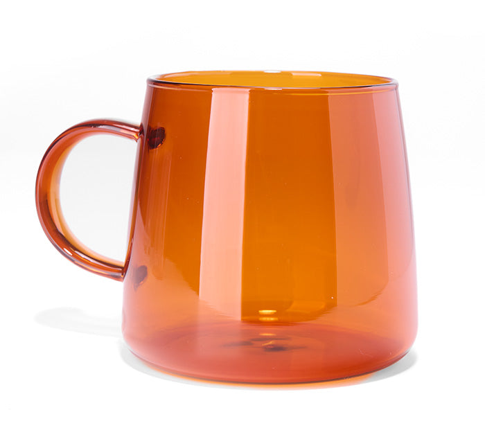 Orange tea mug on a white background