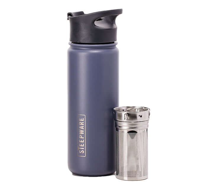 a mountain tea tumbler with an infuser sitting next to it