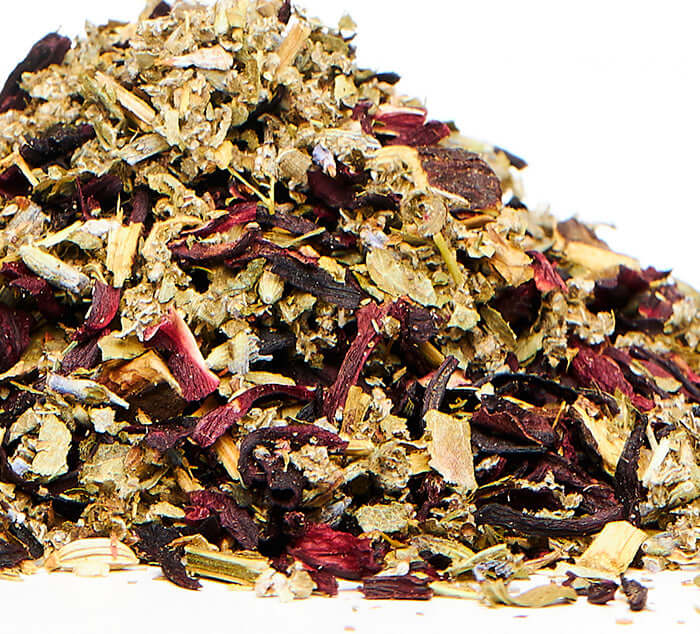 loose organic herbal pms tea on a white background