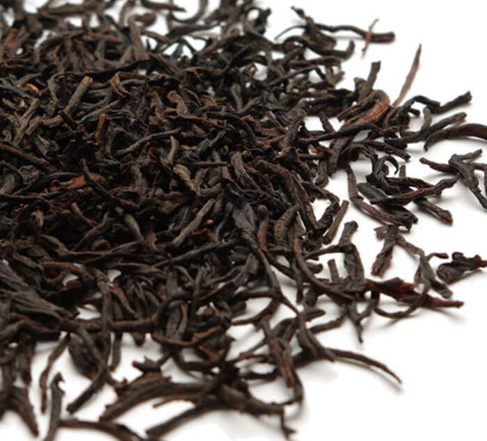 Ceylon Loose Leaf Tea loose leaf black tea sits on a white surface
