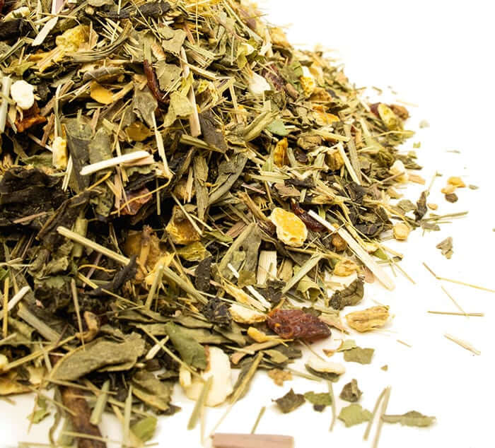 pile of loose leaf Decaf Lemon Green tea on a white background