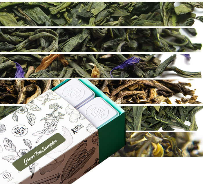 Premium Loose Leaf Green Teas Sampler six different piles of green tea leaves in the background with a sampler of tea tins is in the foreground