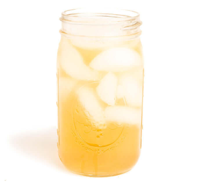 Jasmine Petals Iced Tea Brewed in a mason jar on a white background