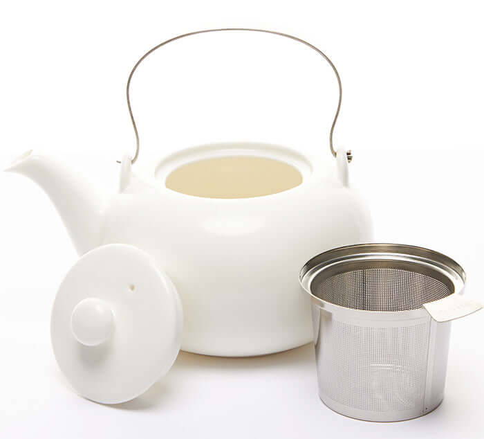 White satin teapot with lid and stainless steel infuser, perfect for brewing loose leaf tea, 34 oz capacity.